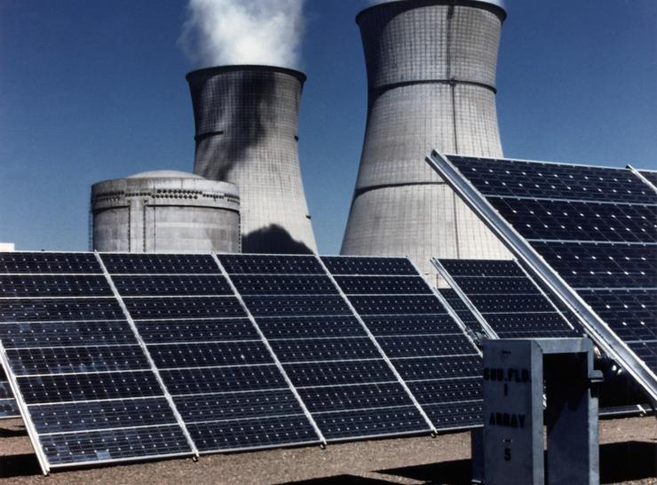 Power station cooling towers and solar panels
